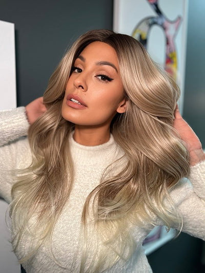 Roxie wearing ALLURE WAVEZ by RENE OF PARIS in  MELTED-MARSHMALLOW | Subtly Warm Dark Sandy Blonde Blend with Medium Brown Roots and Light Ash Blonde Tips and Highlights