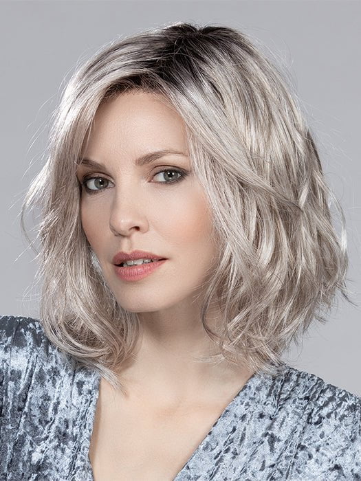 This synthetic wig has a monofilament part and extended lace front for a realistic appearance