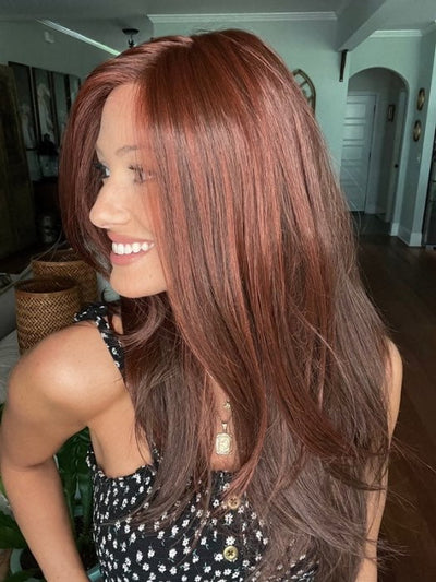 Jenna Fail @jenna_fail wearing GLAM by TRESSALLURE in color 10/130R | Bright Red with Medium Brown Roots