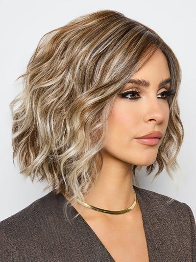 A Bohemian-inspired hairstyle with beachy waves and choppy layers