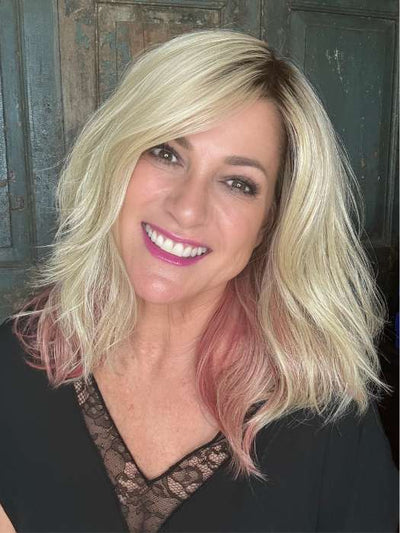 Susan Cooke @wigs_with_wisdom wearing TABU by ELLEN WILLE in color ROSE BLONDE ROOTED | Medium Dark Brown Roots that melt into a Pale Golden Blonde with a Mixture of Pink Tones Underneath with Dark Roots